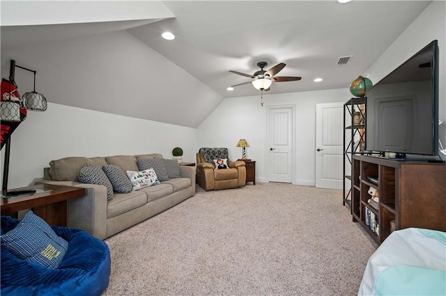 living room with vaulted ceiling, light colored carpet, and ceiling fan