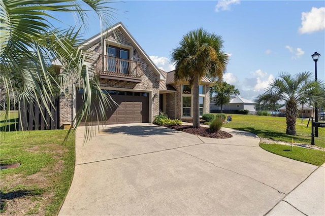 view of front of property featuring a garage and a front lawn