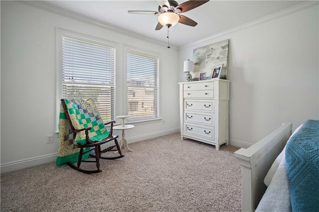 sitting room with light colored carpet, ceiling fan, and ornamental molding