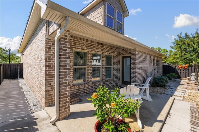 back of property featuring a patio area