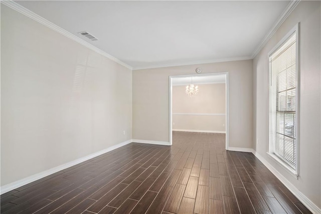 spare room with ornamental molding, an inviting chandelier, and dark wood-type flooring