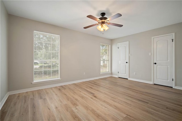 spare room with ceiling fan and light hardwood / wood-style flooring