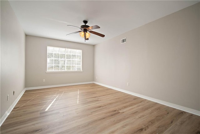 unfurnished room featuring ceiling fan and light hardwood / wood-style flooring