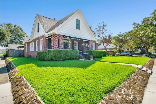 view of side of home with a yard