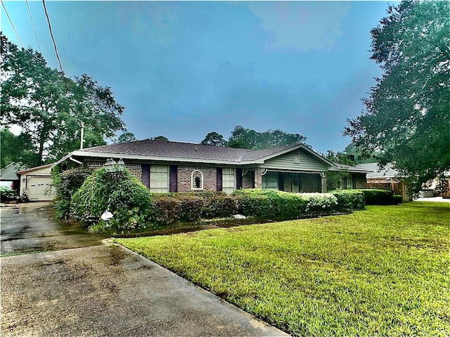 view of front facade with a front yard and a garage