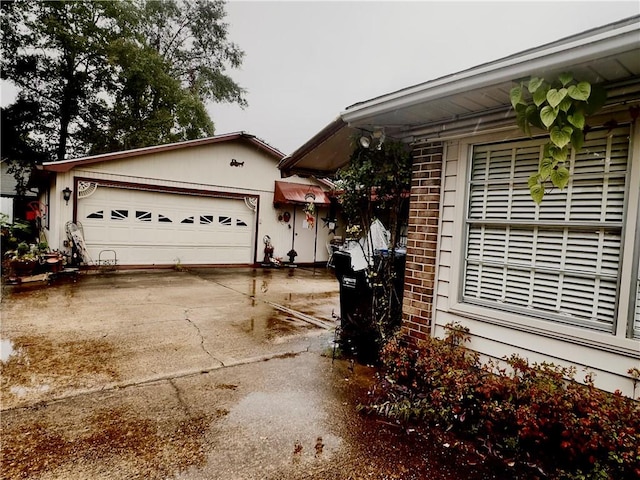 view of side of home with a garage