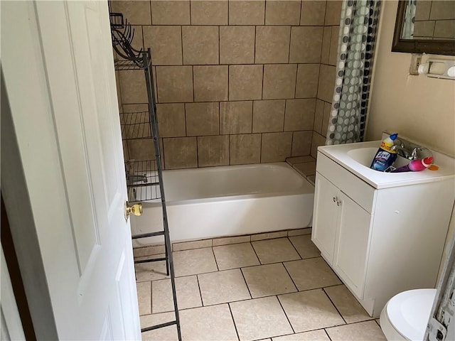 bathroom featuring tile patterned flooring, vanity, and shower / bathtub combination with curtain