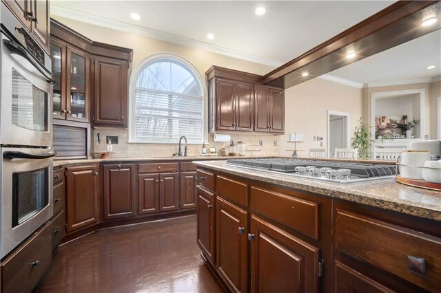 6721 Stonebrook Dr N, Mobile, AL 36695 - kitchen with crown molding, a sink, stainless steel appliances, backsplash, and light stone countertops