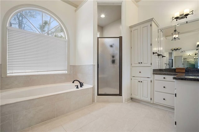 6721 Stonebrook Dr N, Mobile, AL 36695 - full bath featuring vanity, a garden tub, a shower stall, and tile patterned floors