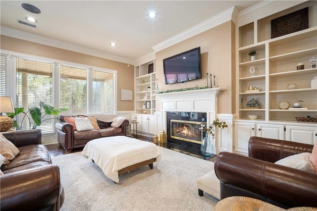 6721 Stonebrook Dr N, Mobile, AL 36695 - living room featuring built in shelves, ornamental molding, a fireplace, wainscoting, and recessed lighting