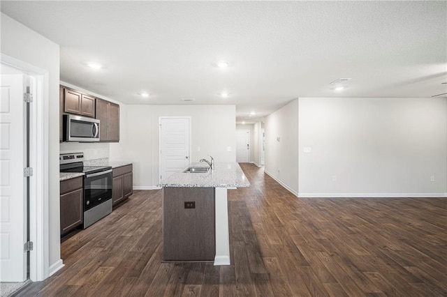10529 Wales Ln, Spanish Fort, AL 36527 - kitchen featuring appliances with stainless steel finishes, open floor plan, dark wood-type flooring, dark brown cabinetry, and recessed lighting