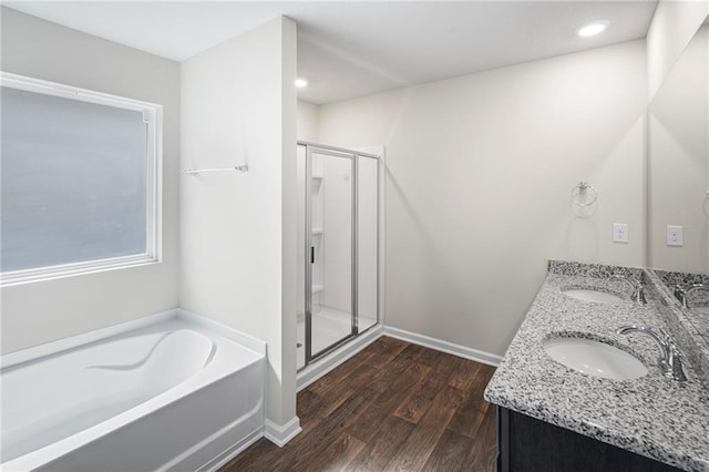10529 Wales Ln, Spanish Fort, AL 36527 - full bath with a shower stall, a garden tub, double vanity, wood finished floors, and recessed lighting