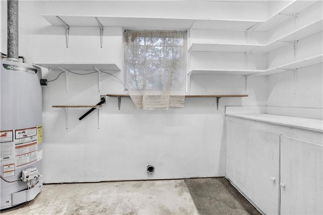 spacious closet featuring water heater