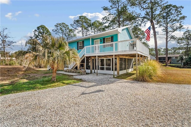 back of house with a sunroom