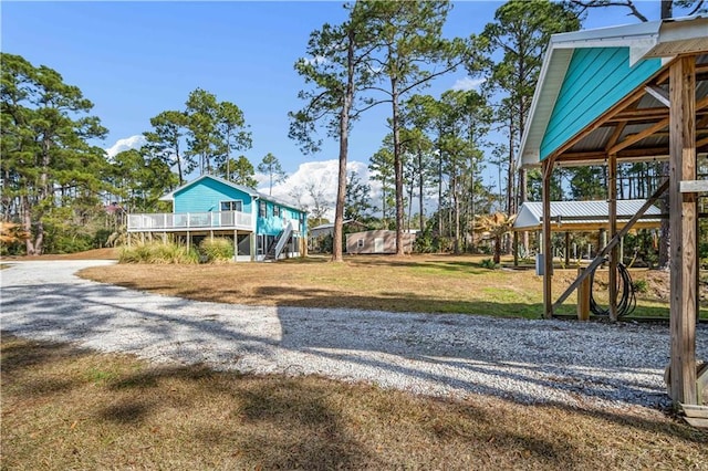 view of play area with a yard and a deck