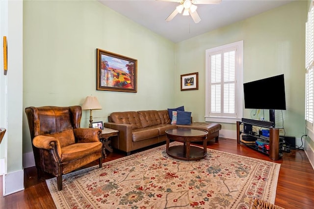 living area featuring ceiling fan and wood finished floors