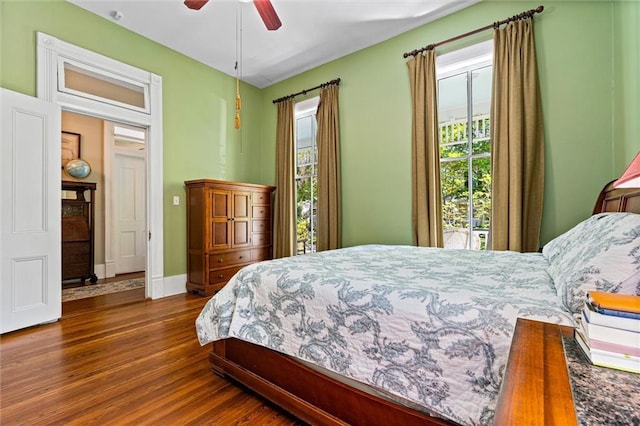 bedroom with a ceiling fan and wood finished floors