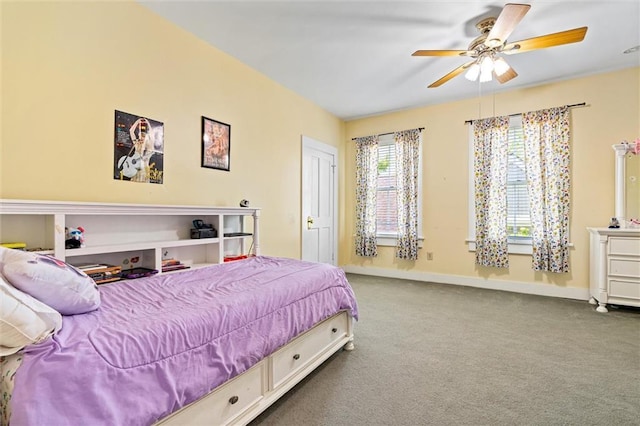 carpeted bedroom with baseboards and ceiling fan