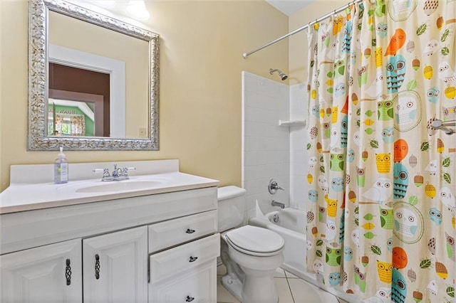 bathroom featuring toilet, shower / bath combo, vanity, and tile patterned floors