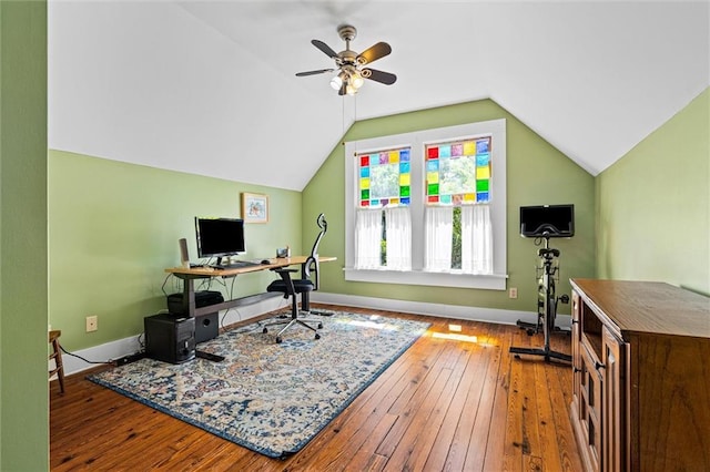 office area with baseboards, hardwood / wood-style floors, a ceiling fan, and lofted ceiling
