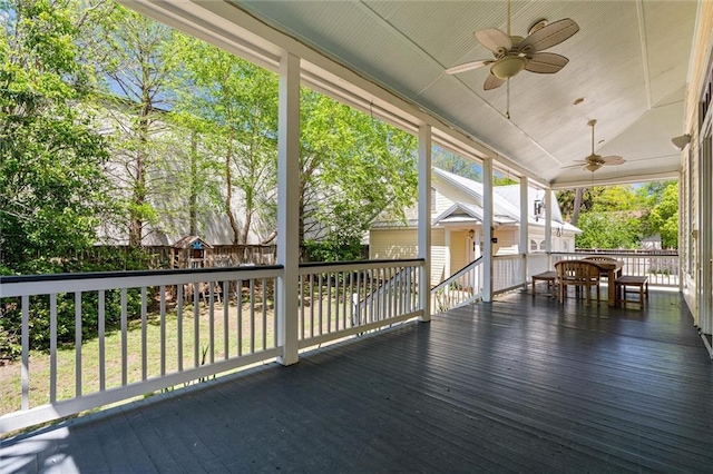 wooden deck featuring a ceiling fan