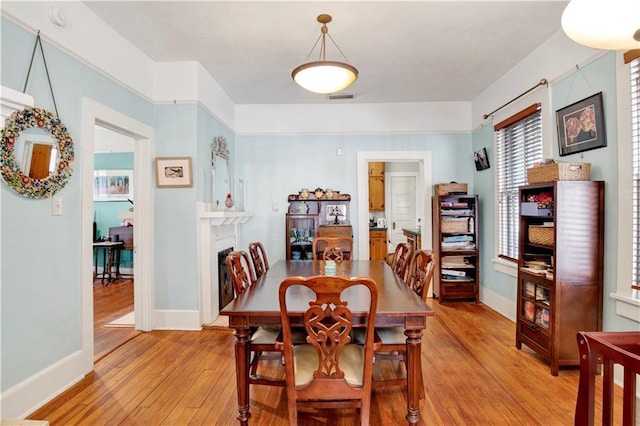 dining room with light hardwood / wood-style floors