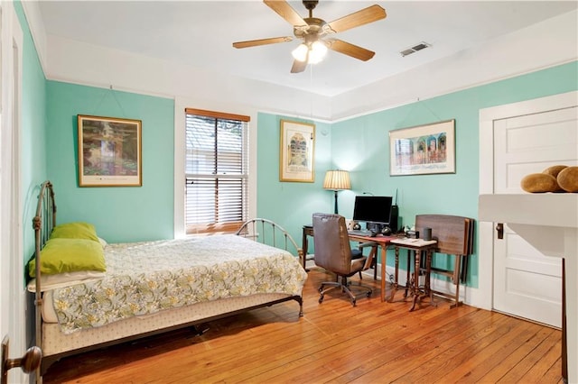 bedroom featuring ceiling fan and wood-type flooring