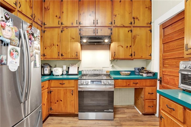 kitchen featuring light hardwood / wood-style flooring and stainless steel appliances