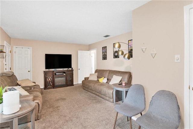 carpeted living area with visible vents