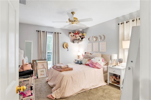 carpeted bedroom featuring visible vents and ceiling fan