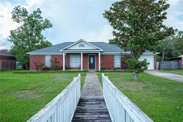 view of front facade with a garage and a front lawn