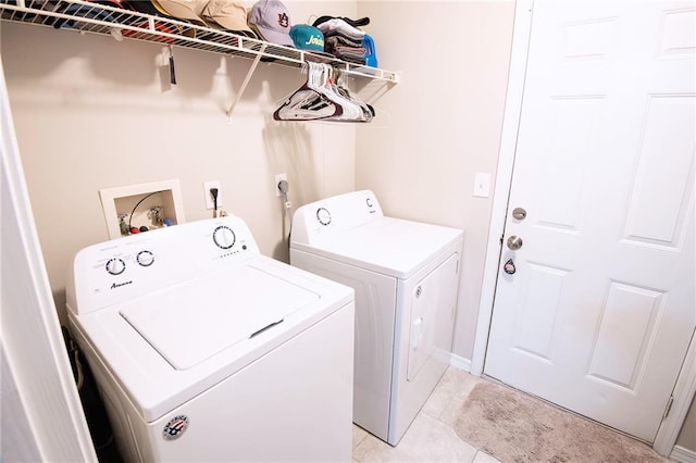 washroom featuring light tile patterned floors and independent washer and dryer