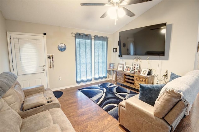 living room with ceiling fan, dark hardwood / wood-style flooring, and lofted ceiling