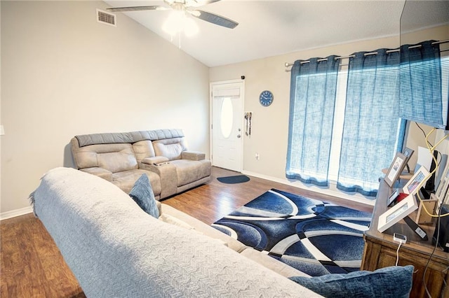 living room featuring hardwood / wood-style flooring, lofted ceiling, and ceiling fan