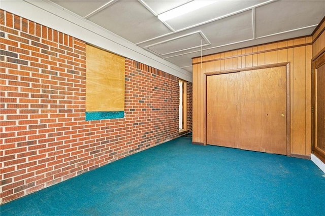 5416 Hilltop Dr N, Mobile, AL 36608 - below grade area featuring carpet, brick wall, and wood walls