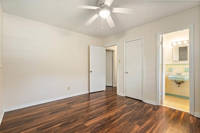 5416 Hilltop Dr N, Mobile, AL 36608 - unfurnished bedroom featuring dark wood-type flooring, connected bathroom, and a ceiling fan