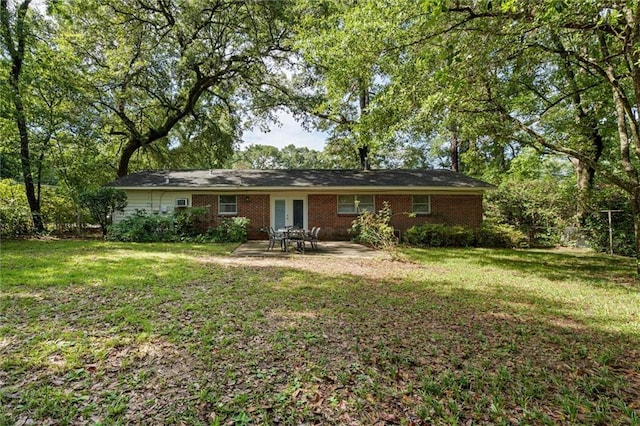 5416 Hilltop Dr N, Mobile, AL 36608 - rear view of house with french doors, a patio area, and brick siding