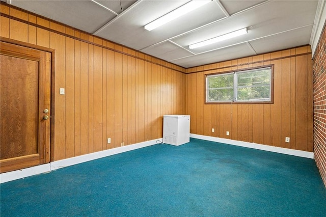5416 Hilltop Dr N, Mobile, AL 36608 - spare room featuring carpet and wooden walls