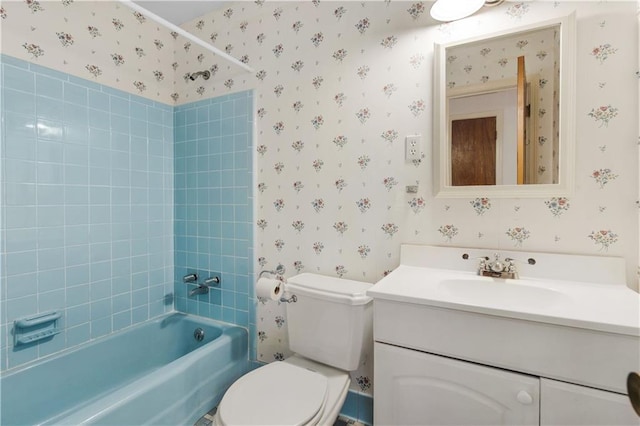 full bathroom featuring vanity, toilet, and tiled shower / bath