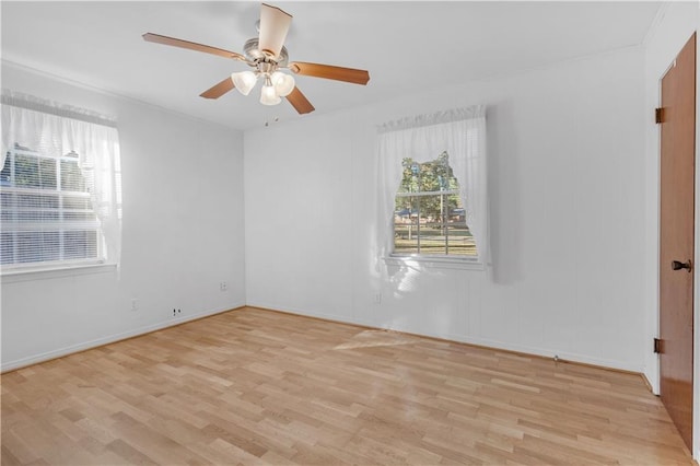 spare room featuring ceiling fan and light wood-type flooring