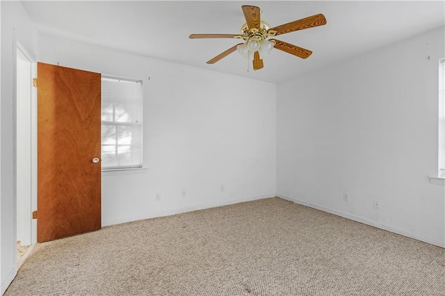 carpeted empty room with ceiling fan