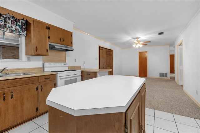 kitchen featuring sink, a center island, electric range, crown molding, and light carpet