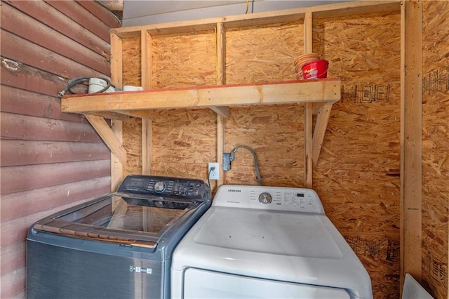 laundry room featuring separate washer and dryer