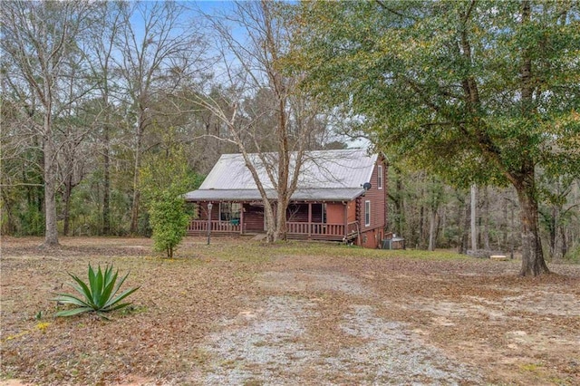 cabin featuring covered porch