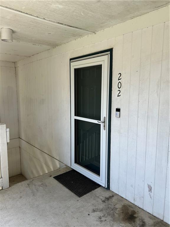 6050 Grelot Rd Unit 202, Mobile, AL 36609 - doorway to property with visible vents