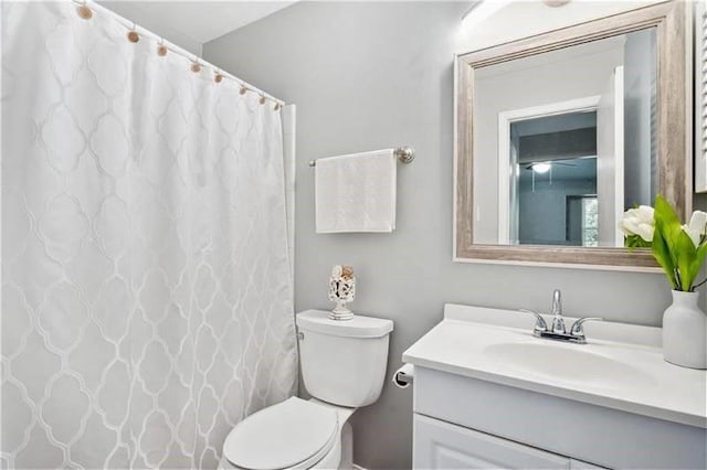 6050 Grelot Rd Unit 202, Mobile, AL 36609 - full bathroom with toilet, a shower with curtain, and vanity