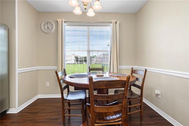 13578 James Copeland Dr, Mobile, AL 36695 - dining area featuring a chandelier, dark wood-style floors, and baseboards