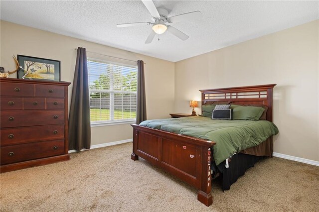 13578 James Copeland Dr, Mobile, AL 36695 - bedroom featuring light carpet, baseboards, a textured ceiling, and ceiling fan