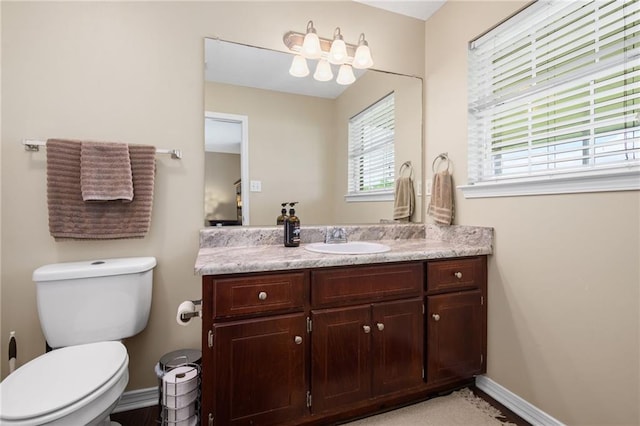 13578 James Copeland Dr, Mobile, AL 36695 - half bathroom featuring baseboards, toilet, and vanity