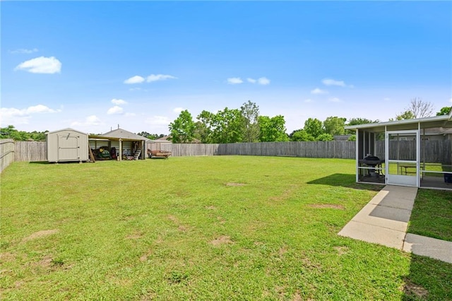 13578 James Copeland Dr, Mobile, AL 36695 - view of yard with a sunroom, a shed, and an outbuilding